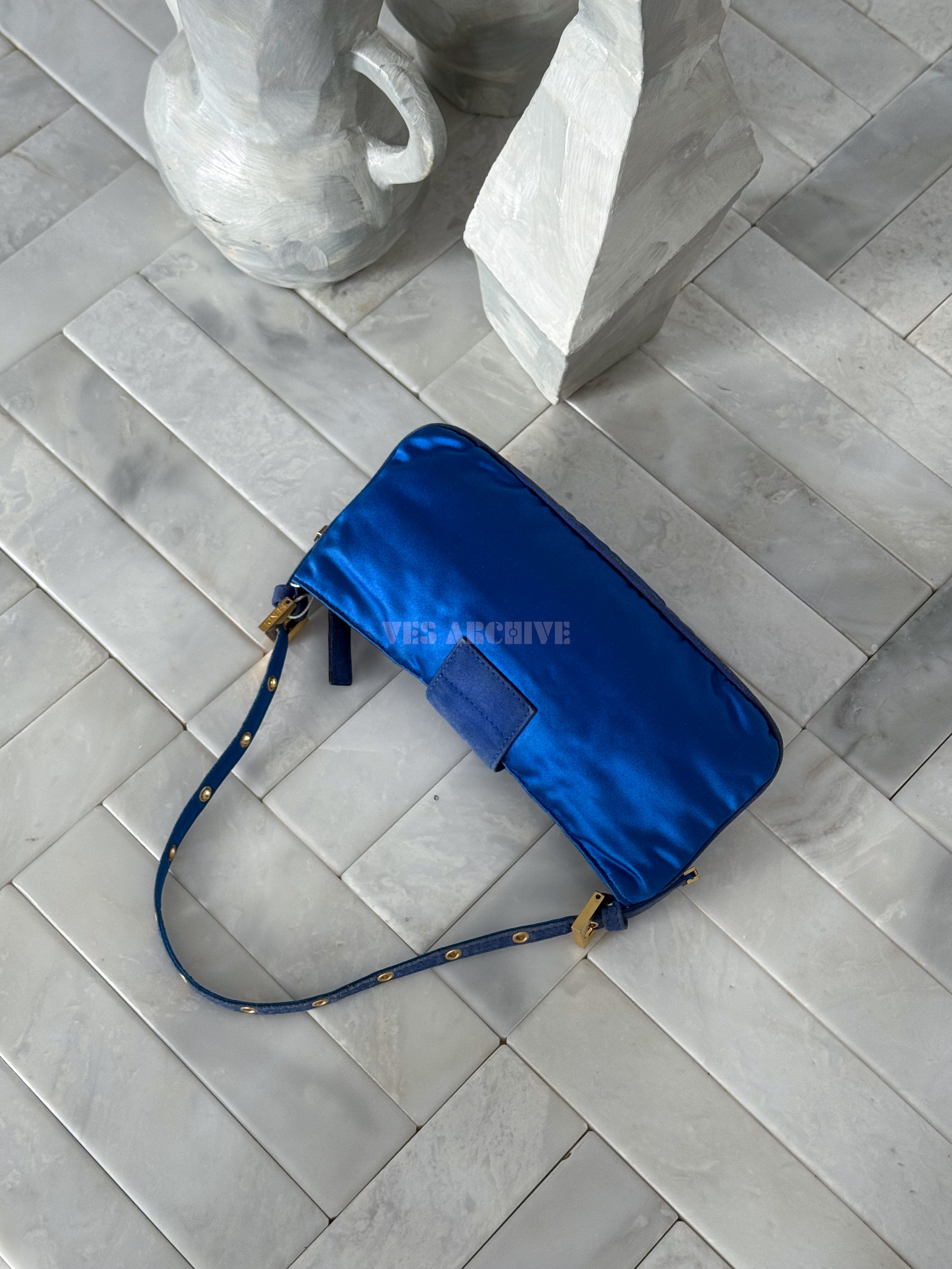 Fendi blue satin Baguette shoulder bag featuring a spider crystal clasp.
