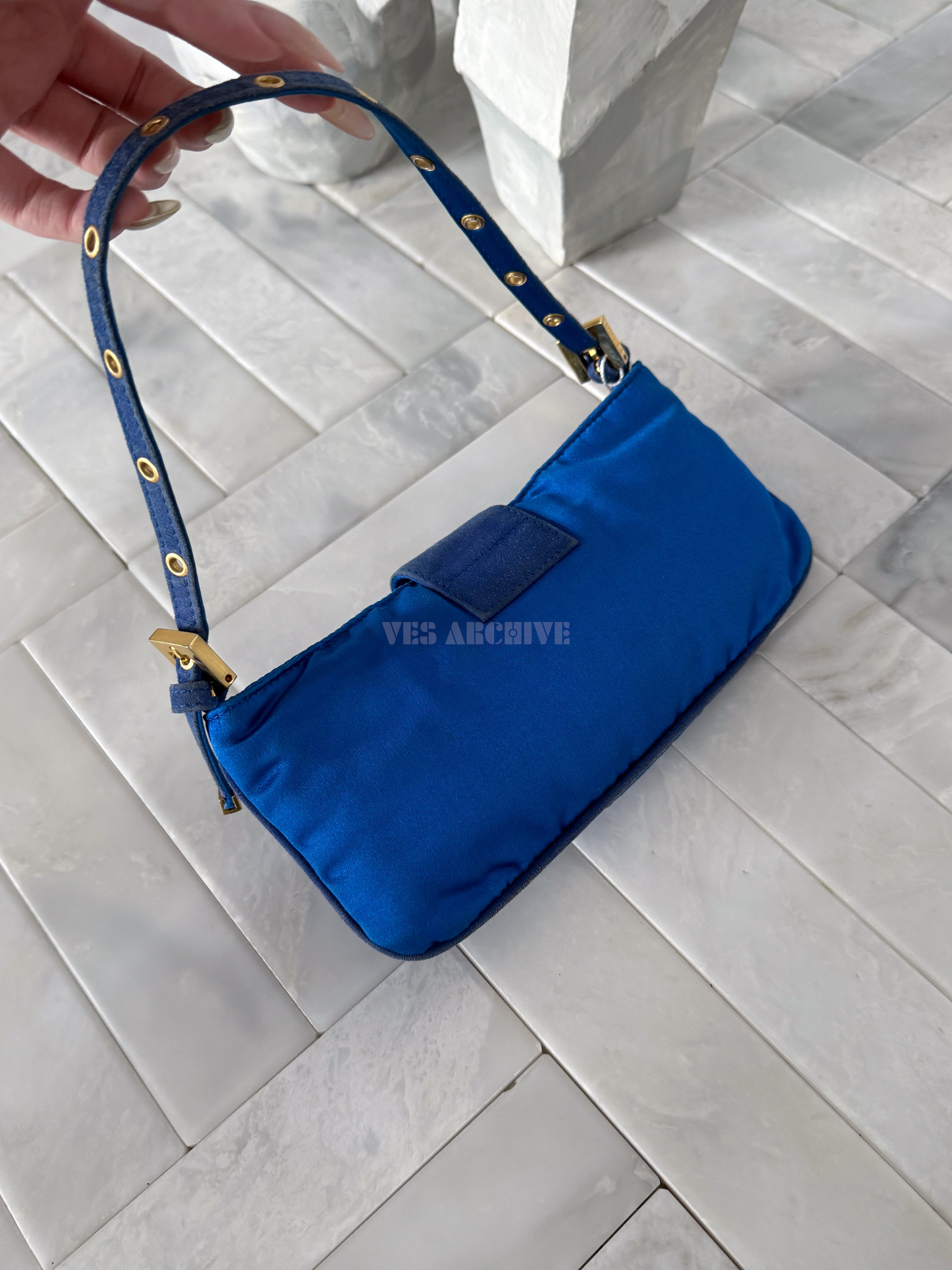 Fendi blue satin Baguette shoulder bag featuring a spider crystal clasp.