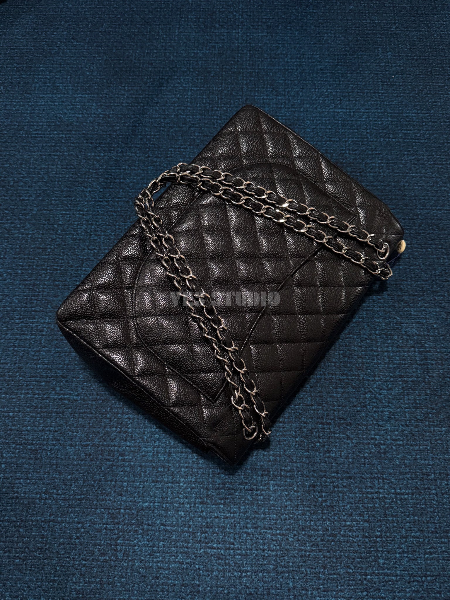 Chanel Maxi Classic Flap Bag in Black Caviar Leather with Silver Hardware