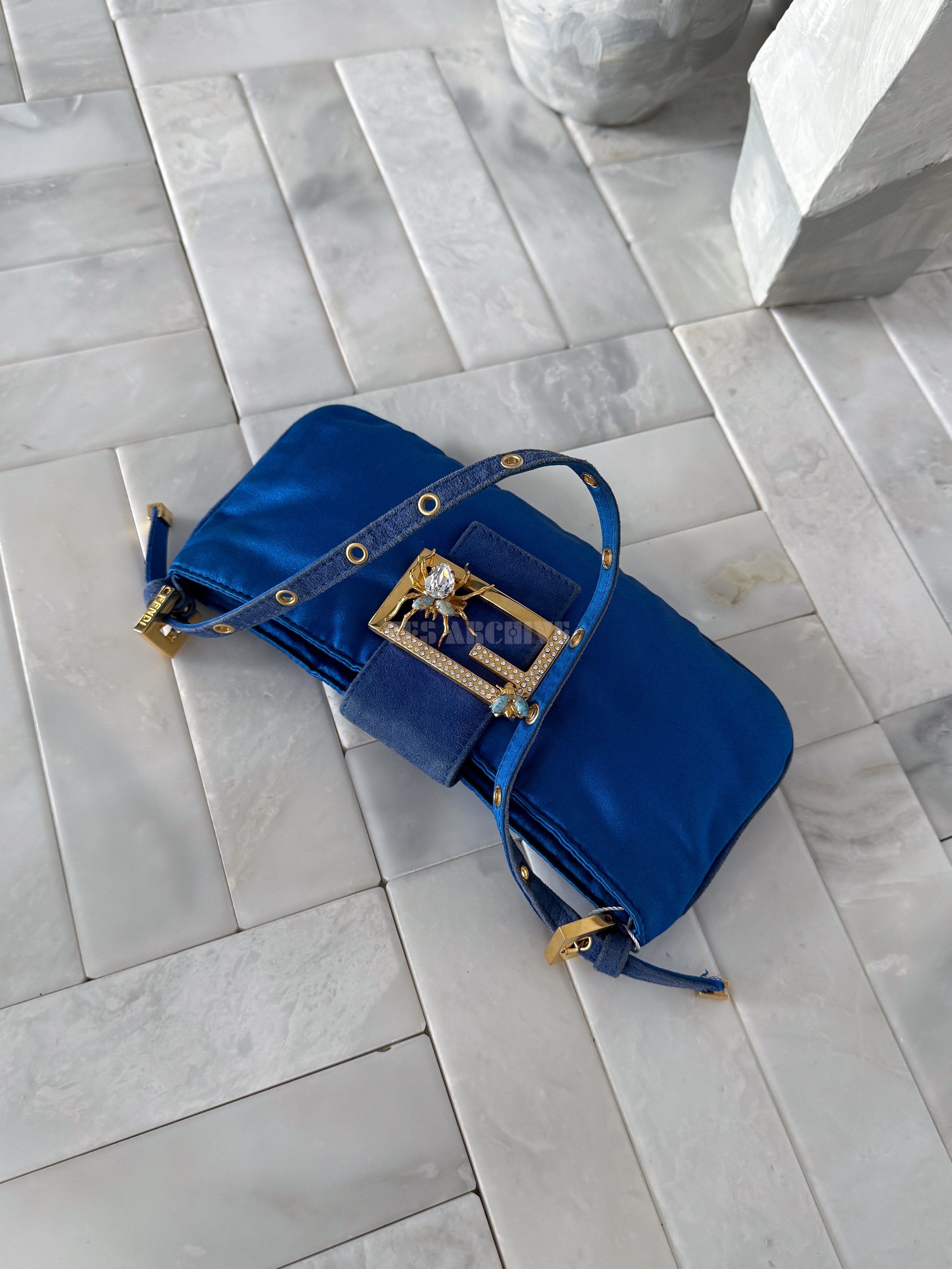 Fendi blue satin Baguette shoulder bag featuring a spider crystal clasp.