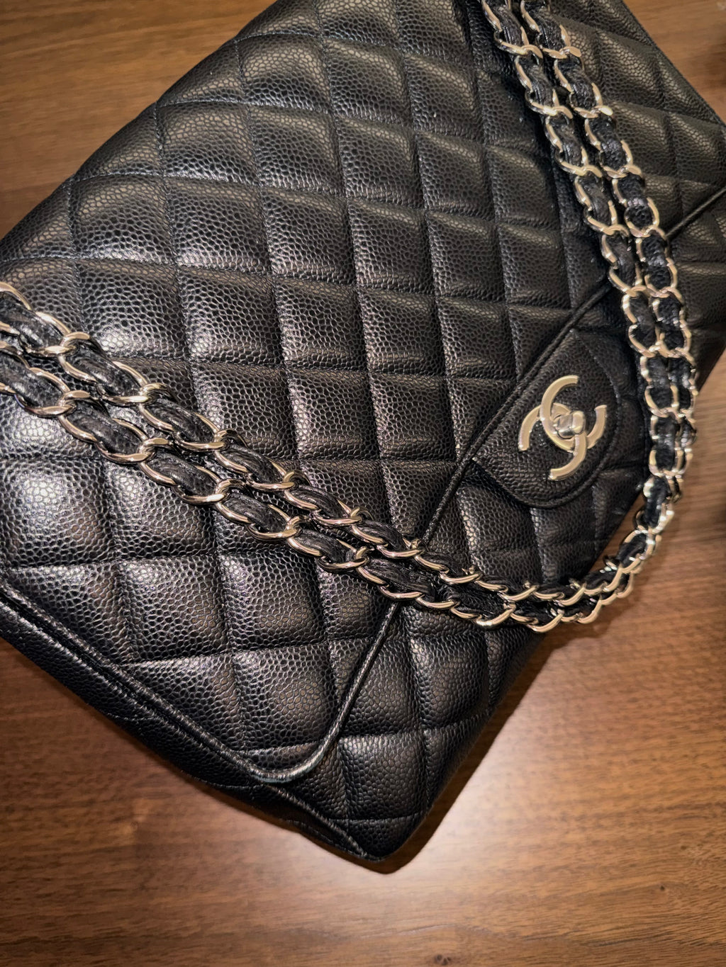 Chanel Maxi Classic Flap Bag in Black Caviar Leather with Silver Hardware