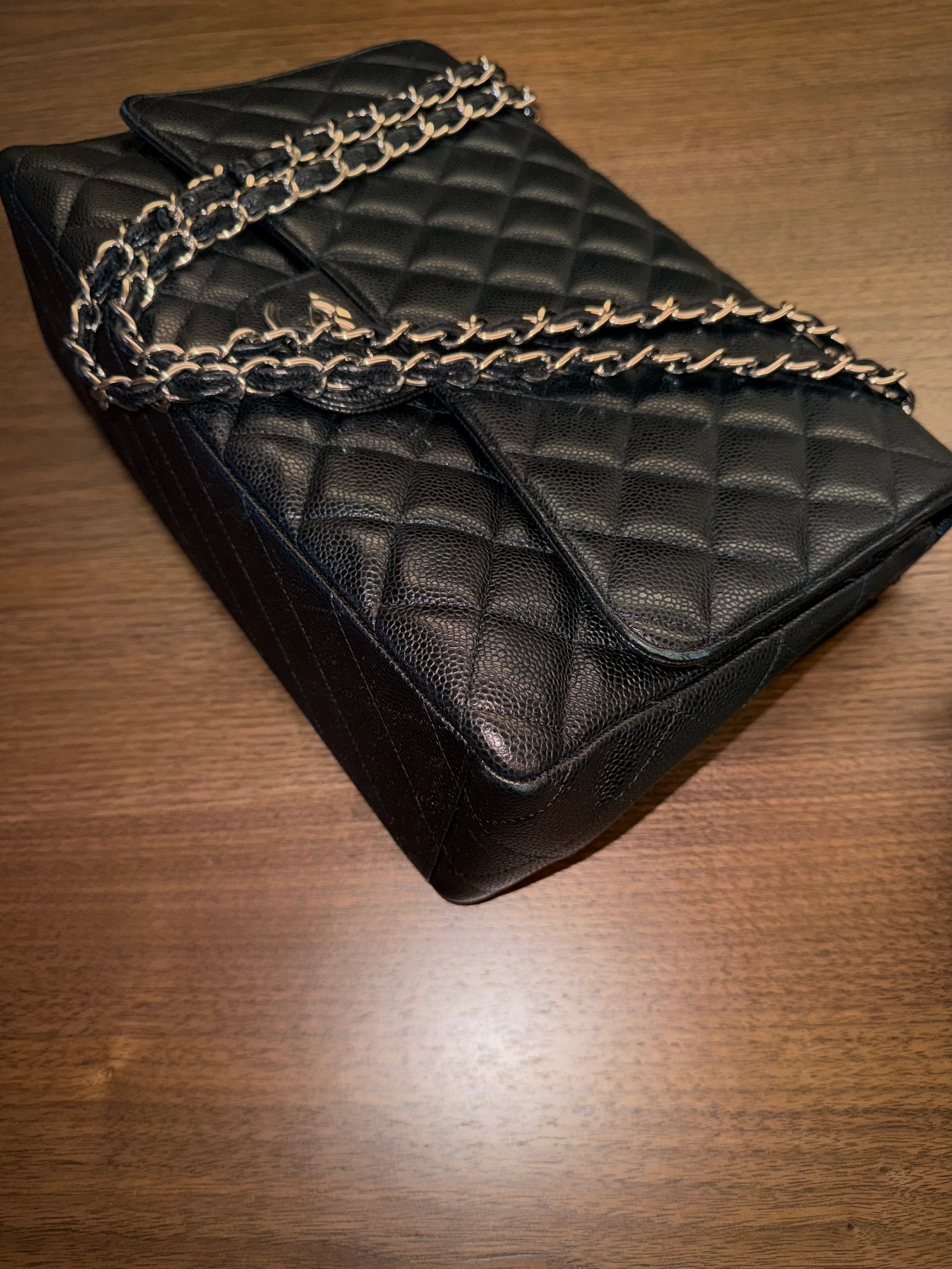 Chanel Maxi Classic Flap Bag in Black Caviar Leather with Silver Hardware