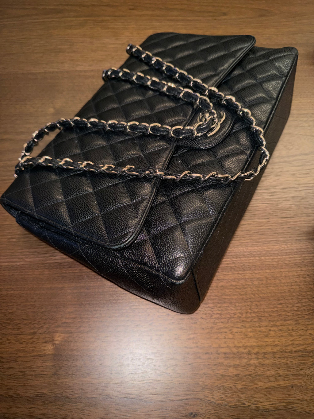 Chanel Maxi Classic Flap Bag in Black Caviar Leather with Silver Hardware